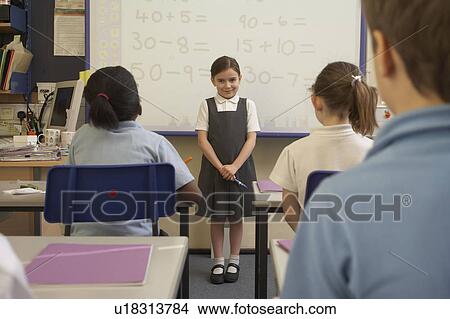Picture - Girl doing her presentation in class. Fotosearch