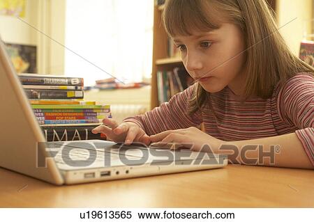Girl on computer View Large Photo Image Stock Photography - Girl on computer. Fotosearch