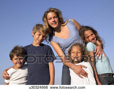 Stock Photograph - Group of kids looking in the camera.. Fotosearch