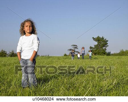 Group of kids running in a field. View Large Photo Image Picture - Group of kids running in a field.. Fotosearch