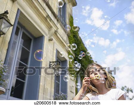Little girl blowing bubbles. View Large Photo Image Stock Photo - Little girl blowing bubbles.. Fotosearch