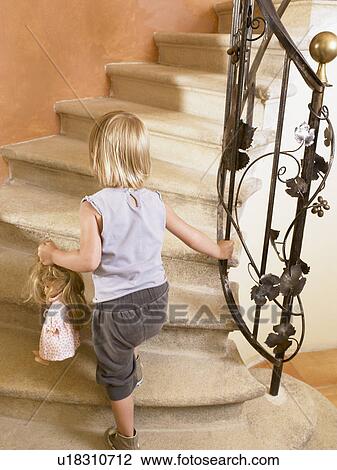 Little girl climbing up the stairs. View Large Photo Image Stock Image - Little girl climbing up the stairs.. Fotosearch