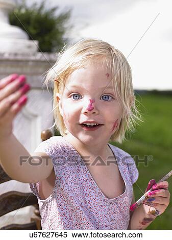 Little girl painting in a green field. View Large Photo Image Stock Photography - Little girl painting in a green field.. Fotosearch