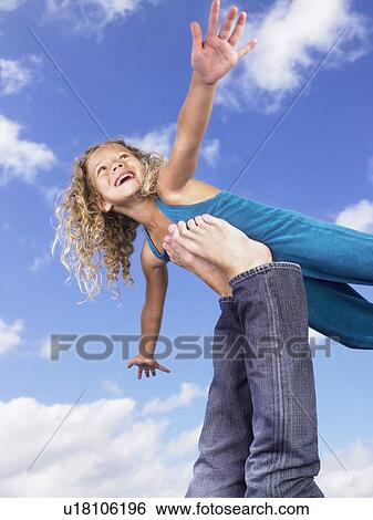 Young girl swirling feet in the air. View Large Photo Image Stock Photograph - Young girl swirling feet in the air.. Fotosearch