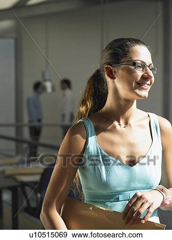 Businesswoman working in an office View Large Photo Image Stock Photo - Businesswoman working in an office. Fotosearch