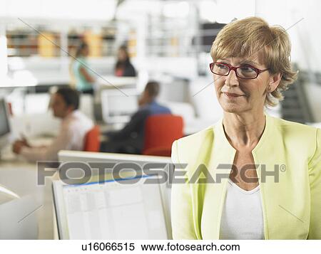 Businesswoman working in an office View Large Photo Image Stock Photography - Businesswoman working in an office. Fotosearch
