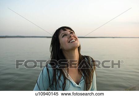 Girl laughing looking skywards. View Large Photo Image Stock Photography - Girl laughing looking skywards.. Fotosearch