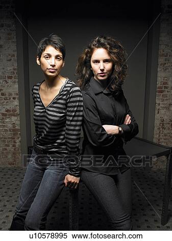 Portrait of two women leaning on table. Brussels, Belgium. View Large Photo Image Stock Photography - Portrait of two women leaning on table. Brussels, Belgium.. Fotosearch