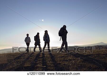4 people on a trek. View Large Photo Image Stock Photo - 4 people on a trek.. Fotosearch