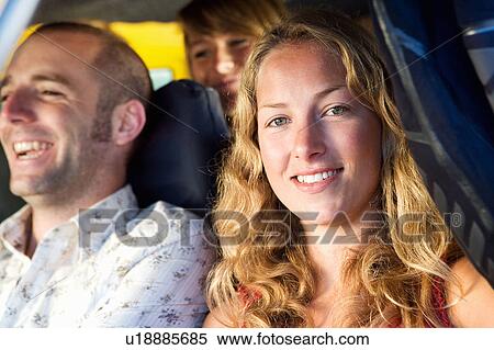 Three people in a van smiling. View Large Photo Image Stock Photography - Three people in a van smiling.. Fotosearch