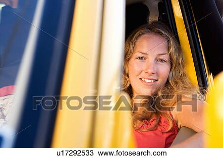 Woman in a van smiling. View Large Photo Image Stock Image - Woman in a van smiling.. Fotosearch