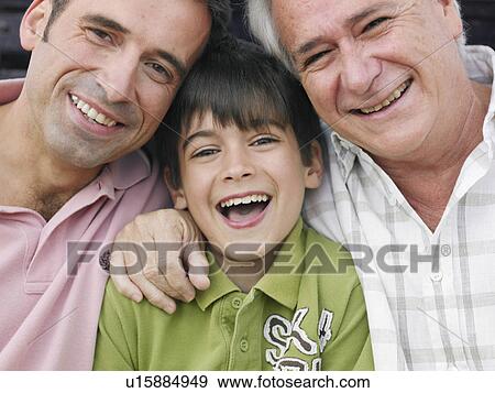 Boy (8-10) sitting with father and grandfather, smiling, close-up, portrait View Large Photo Image Stock Photo - Boy (8-10) sitting with father and grandfather, smiling, close-up, portrait. Fotosearch