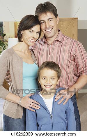 Stock Photo - Family portrait of man woman and boy.. Fotosearch