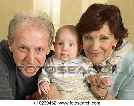 Senior grandparents with baby grandson (1-3 months) smiling, portrait View Large Photo Image Stock Image - Senior grandparents with baby grandson (1-3 months) smiling, portrait. Fotosearch