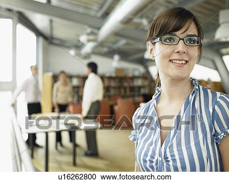 Businesswoman working in an office View Large Photo Image Stock Image - Businesswoman working in an office. Fotosearch