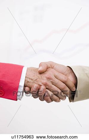 Handshaking close up View Large Photo Image Stock Image - Handshaking close up. Fotosearch