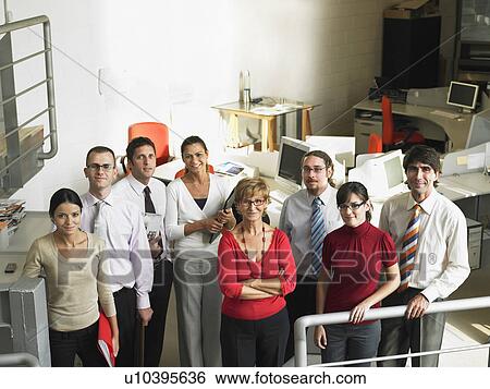 Staff standing together in a group View Large Photo Image Stock Photograph - Staff standing together in a group. Fotosearch