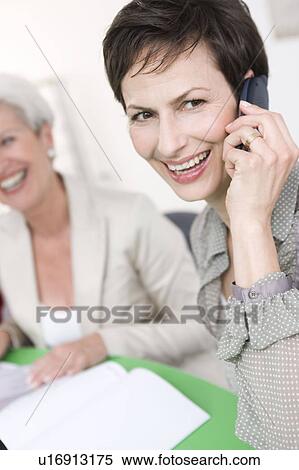 Stock Photography - Two women smiling. Fotosearch