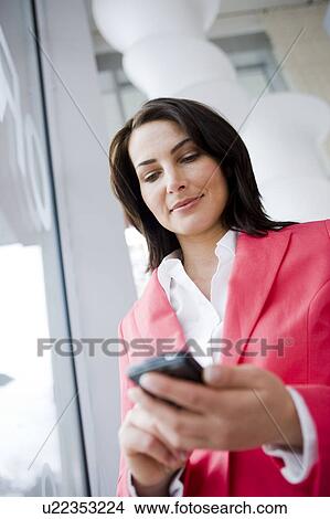 Woman text messaging View Large Photo Image Picture - Woman text messaging. Fotosearch