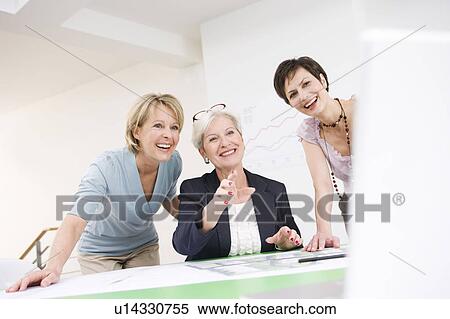Women discussing work View Large Photo Image Stock Photography - Women discussing work. Fotosearch