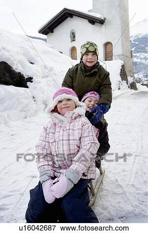 Children sledging down slope View Large Photo Image Stock Photo - Children sledging down slope. Fotosearch