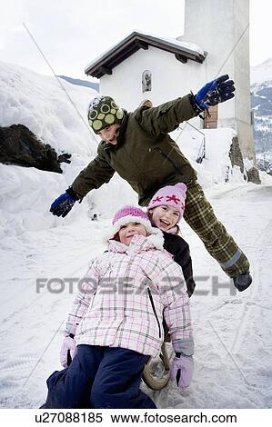 Children sledging down slope View Large Photo Image Stock Photography - Children sledging down slope. Fotosearch