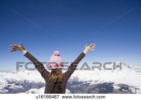Stock Photo - Girl looking at mountains. Fotosearch