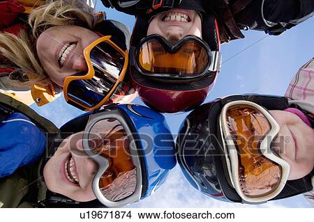 Mother with children wearing ski helmets View Large Photo Image Picture - Mother with children wearing ski helmets. Fotosearch