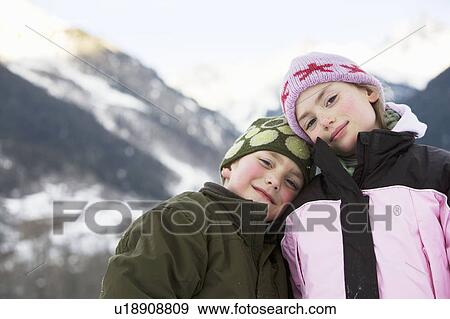Portrait of boy and girl in mountains View Large Photo Image Stock Photo - Portrait of boy and girl in mountains. Fotosearch