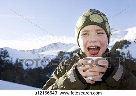 Portrait of boy with drink in mountains View Large Photo Image Stock Image - Portrait of boy with drink in mountains. Fotosearch