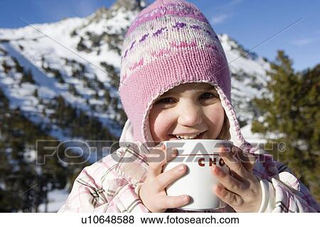 Stock Photo - Portrait of girl with drink in mountains. Fotosearch