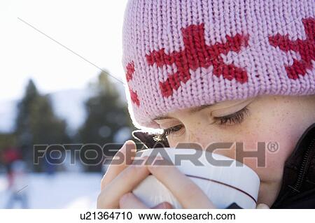 Portrait of girl with drink in snow View Large Photo Image Stock Image - Portrait of girl with drink in snow. Fotosearch