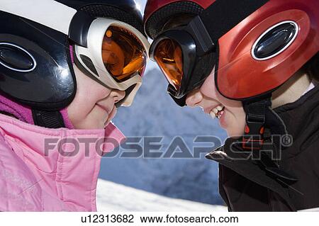 Portrait of young girls in ski kit View Large Photo Image Stock Image - Portrait of young girls in ski kit. Fotosearch