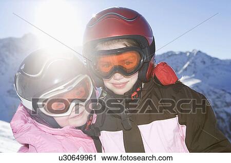 Portrait of young girls in ski kit View Large Photo Image Stock Image - Portrait of young girls in ski kit. Fotosearch