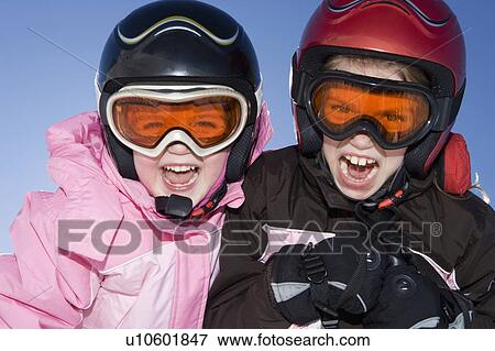 Portrait of young girls in ski kit View Large Photo Image Stock Photo - Portrait of young girls in ski kit . Fotosearch