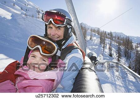Young girl and grandmother on chair lift View Large Photo Image Stock Image - Young girl and grandmother on chair lift. Fotosearch