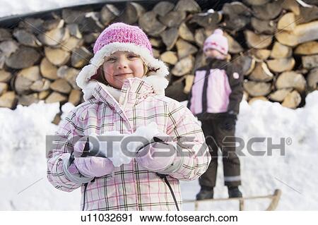 Young girls having fun in the snow View Large Photo Image Stock Image - Young girls having fun in the snow. Fotosearch
