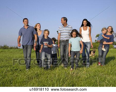 Group of people and children walking. View Large Photo Image Stock Image - Group of people and children walking.. Fotosearch