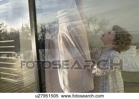 Mother and daughter (0-2) at window. View Large Photo Image Stock Photography - Mother and daughter (0-2) at window.. Fotosearch