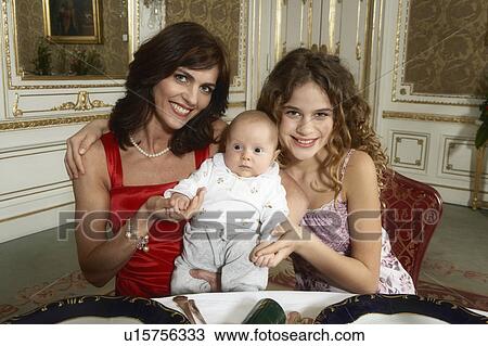 Mother with daughter (9-11) and baby (3-6 months), smiling, portrait View Large Photo Image Stock Image - Mother with daughter (9-11) and baby (3-6 months), smiling, portrait. Fotosearch