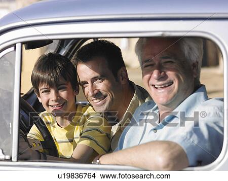 Boy (8-10) sitting in car with father and grandfather, smiling, side view, portrait View Large Photo Image Picture - Boy (8-10) sitting in car with father and grandfather, smiling, side view, portrait. Fotosearch