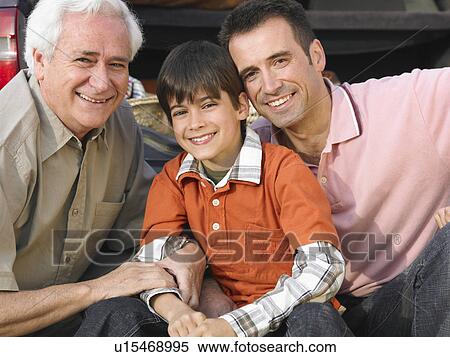 Boy (8-10) sitting with father and grandfather, smiling, close-up, portrait View Large Photo Image Stock Photography - Boy (8-10) sitting with father and grandfather, smiling, close-up, portrait. Fotosearch