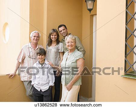 Multi-generational family standing on front porch, smiling, portrait View Large Photo Image Stock Photo - Multi-generational family standing on front porch, smiling, portrait. Fotosearch