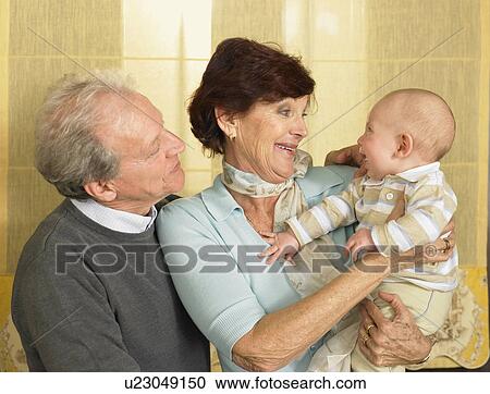 Senior grandparents with baby grandson (1-3 months) smiling View Large Photo Image Stock Image - Senior grandparents with baby grandson (1-3 months) smiling. Fotosearch