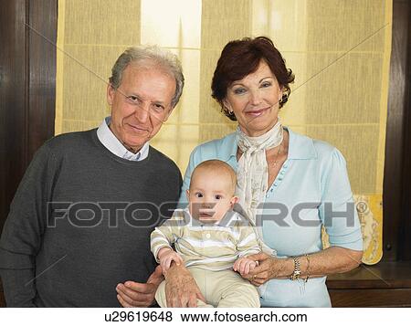 Senior grandparents with baby grandson (1-3 months) smiling, portrait View Large Photo Image Stock Photo - Senior grandparents with baby grandson (1-3 months) smiling, portrait. Fotosearch
