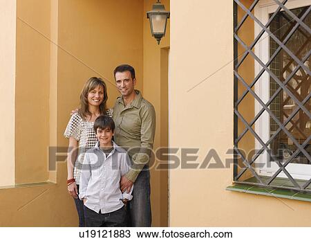 Family standing on front porch, smiling, portrait View Large Photo Image Stock Image - Family standing on front porch, smiling, portrait. Fotosearch
