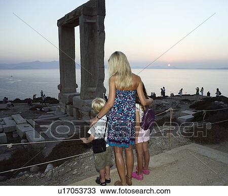 Woman with young boy and young girl looking at The Portara in Greece with tourists in background. View Large Photo Image Stock Image - Woman with young boy and young girl looking at The Portara in Greece with tourists in background.. Fotosearch