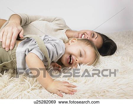 Daughter and mother playing. View Large Photo Image Stock Photo - Daughter and mother playing.. Fotosearch