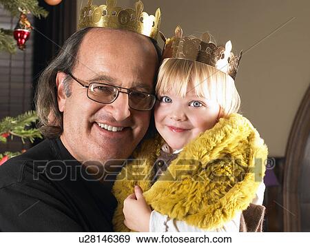 Girl and grandfather with crowns View Large Photo Image Stock Photo - Girl and grandfather with crowns. Fotosearch