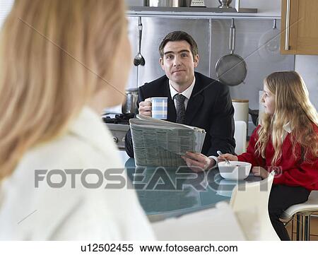 Man at breakfast table with daughter View Large Photo Image Stock Photography - Man at breakfast table with daughter. Fotosearch